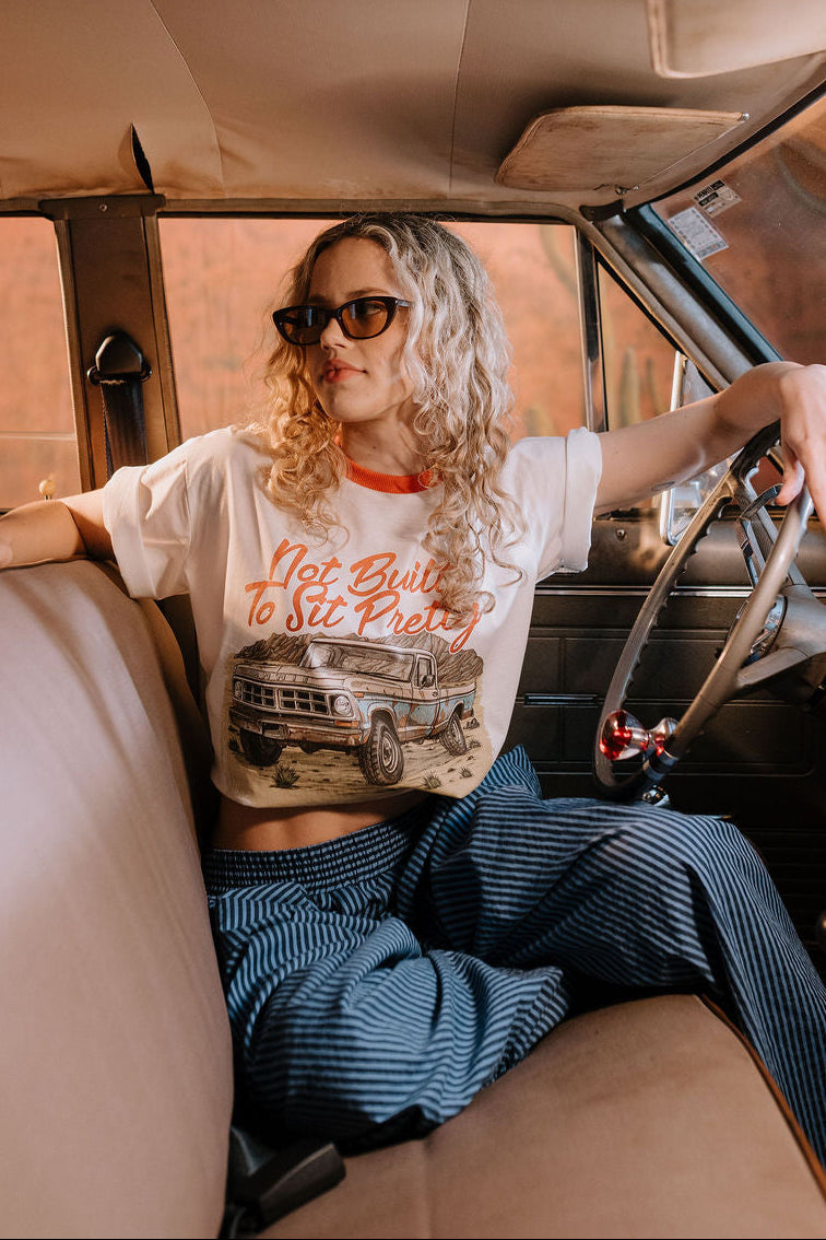 Annie - Not Built To Sit Pretty Tee - White